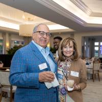 Alan and Debbie Abraham smiling at camera